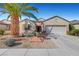 Charming single-story home featuring a two-car garage, desert landscaping, and a well-maintained front yard at 2520 Eclipsing Stars Dr, Henderson, NV 89044