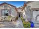 Inviting home exterior featuring a well-manicured front yard with desert landscaping and a two-car garage at 2520 Eclipsing Stars Dr, Henderson, NV 89044