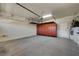 Spacious garage with epoxy flooring, storage cabinets, and overhead storage racks for maximum organization at 2520 Eclipsing Stars Dr, Henderson, NV 89044