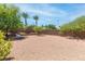 Large backyard featuring desert landscaping with a small patio and privacy walls at 2799 Alnwick Ct, Henderson, NV 89044