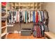 Walk-in closet with custom shelving for optimal storage and organization at 2799 Alnwick Ct, Henderson, NV 89044