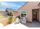 Cozy front porch with seating area, planters, and stylish entryway at 2799 Alnwick Ct, Henderson, NV 89044