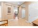 Hallway featuring tile flooring, neutral walls, and doorway into living room at 2799 Alnwick Ct, Henderson, NV 89044