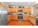 Well-appointed kitchen with stainless steel appliances, wood cabinetry, and granite countertops at 2799 Alnwick Ct, Henderson, NV 89044