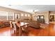 Open living space with hardwood floors, a comfortable sofa, dining area, and tasteful decorations at 2799 Alnwick Ct, Henderson, NV 89044