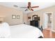 Bright main bedroom with hardwood floors and a view of the attached main bathroom at 2799 Alnwick Ct, Henderson, NV 89044