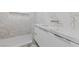 Bathroom featuring marble wall with wave pattern and undermount sink at 3075 Santa Margarita St, Las Vegas, NV 89146