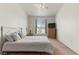 Bright bedroom showcasing a comfortable bed, ceiling fan, and window letting in natural light at 3360 Cactus Shadow St # 203, Las Vegas, NV 89129