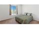 Bedroom with neutral carpet, window with blinds, and cozy floral decorative pillows at 3360 Cactus Shadow St # 203, Las Vegas, NV 89129