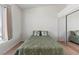 Bedroom features neutral carpet, mirrored closet doors, and a large window at 3360 Cactus Shadow St # 203, Las Vegas, NV 89129
