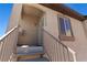 Exterior view showcasing the front door with stairs, security door, and covered entryway at 3360 Cactus Shadow St # 203, Las Vegas, NV 89129