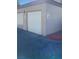 A two-car garage with white doors and a 