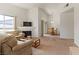 Open concept living area with fireplace, comfortable seating, and dining area at 3360 Cactus Shadow St # 203, Las Vegas, NV 89129