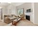 Inviting living room with fireplace, neutral decor, and ample natural light at 3360 Cactus Shadow St # 203, Las Vegas, NV 89129