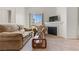 Comfortable living room features a fireplace and entertainment center at 3360 Cactus Shadow St # 203, Las Vegas, NV 89129