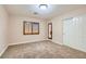 Bright bedroom with carpet, exterior door, and shuttered window for natural light at 368 Misty Moonlight St, Henderson, NV 89015