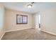 Cozy bedroom with carpet flooring, natural light, and a convenient ensuite bathroom at 368 Misty Moonlight St, Henderson, NV 89015