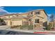Charming home with a three-car garage, landscaped front yard, and stone veneer at 368 Misty Moonlight St, Henderson, NV 89015