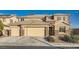 Beautiful two-story home with a three-car garage and stone accents at 368 Misty Moonlight St, Henderson, NV 89015