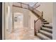 Elegant foyer featuring a staircase and tiled floor at 368 Misty Moonlight St, Henderson, NV 89015