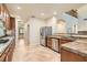 Modern kitchen with stainless steel appliances, granite countertops, and wood cabinetry at 368 Misty Moonlight St, Henderson, NV 89015