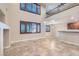 Spacious living room with open floor plan, high ceilings, and large windows at 368 Misty Moonlight St, Henderson, NV 89015