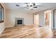 Living room features hardwood floors, fireplace, and open doorway at 368 Misty Moonlight St, Henderson, NV 89015