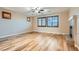 Spacious living room with hardwood floors, fireplace, and window shutters at 368 Misty Moonlight St, Henderson, NV 89015