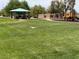 Community park featuring open green space, a covered picnic area, and a playground at 368 Misty Moonlight St, Henderson, NV 89015