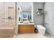 Bright bathroom featuring a vanity with vessel sink and glass enclosed shower with bench at 3726 Las Vegas Blvd # 2410, Las Vegas, NV 89158