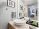Modern bathroom featuring vanity with vessel sink, framed mirror, and glass enclosed shower at 3726 Las Vegas Blvd # 2410, Las Vegas, NV 89158