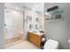 Bright bathroom featuring a vanity with vessel sink and glass enclosed shower with bench at 3726 Las Vegas Blvd # 2410, Las Vegas, NV 89158