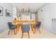 Modern dining room with glass table, stylish grey chairs, and pendant lighting adjacent to the kitchen at 3726 Las Vegas Blvd # 2410, Las Vegas, NV 89158