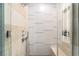 Modern shower with stone and decorative tile surround and rain shower head at 3726 Las Vegas Blvd # 2410, Las Vegas, NV 89158