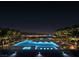 Stunning night view of the illuminated pool area with city lights in the distance at 400 Rock Peak Dr # 2301, Henderson, NV 89012