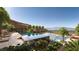 Luxurious community pool area with mountain views and plenty of lounging space at 400 Rock Peak Dr # 2301, Henderson, NV 89012