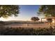 Scenic tennis court with desert landscaping, mountain views, and an adjacent outdoor lounge area at 400 Rock Peak Dr # 2301, Henderson, NV 89012