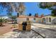 The backyard features a brick grill area and a well-maintained lawn at 4030 Del Monte Ave, Las Vegas, NV 89102