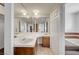 Spacious bathroom featuring a large mirror and double sinks and access to the bathtub at 4030 Del Monte Ave, Las Vegas, NV 89102