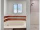 Relaxing bathroom featuring a large soaking tub and a tiled shower at 4030 Del Monte Ave, Las Vegas, NV 89102