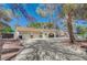 Inviting single-story home with a spacious driveway and mature trees at 4030 Del Monte Ave, Las Vegas, NV 89102