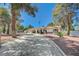 Expansive driveway and desert landscaping accent this bright single-story home at 4030 Del Monte Ave, Las Vegas, NV 89102
