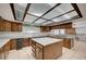 Spacious kitchen features an island, ample counter space, and custom cabinetry at 4030 Del Monte Ave, Las Vegas, NV 89102