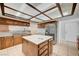 Kitchen with a large island, stainless steel refrigerator and granite countertops at 4030 Del Monte Ave, Las Vegas, NV 89102