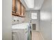 Functional laundry room with washer, dryer, sink and cabinets at 4030 Del Monte Ave, Las Vegas, NV 89102