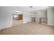 Inviting living space featuring neutral walls, tile flooring, decorative railings and a partial view of the brick fireplace at 4030 Del Monte Ave, Las Vegas, NV 89102