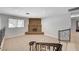 Bright living room features tile flooring, brick fireplace, neutral walls and wrought iron decorative railings at 4030 Del Monte Ave, Las Vegas, NV 89102