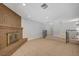 An inviting living room with tile flooring, a classic brick fireplace, and decorative wrought iron railings at 4030 Del Monte Ave, Las Vegas, NV 89102