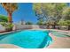 Inviting pool and spa area with lush greenery and mature trees, perfect for outdoor relaxation and entertaining at 4030 Del Monte Ave, Las Vegas, NV 89102