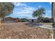 Large dirt backyard with a view of the shed and home at 417 Freeman Ave, Las Vegas, NV 89106